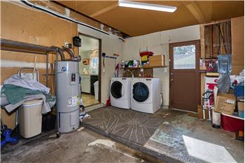 Attached Garage with Washer and Dryer in the Garage.