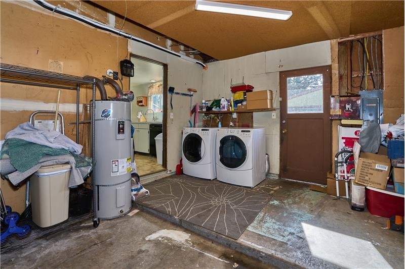 Attached Garage with Washer and Dryer in the Garage.