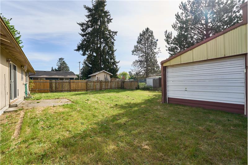 Another View of the Patio, Detached Garage and Fully Fenced Backyard.