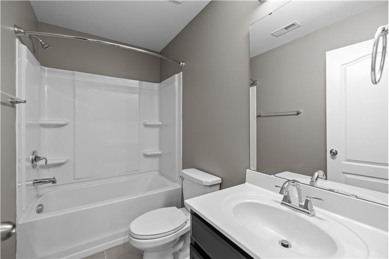 Full bath adjacent to one of the second floor bedrooms