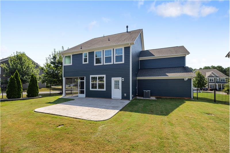 Back view of home; yard fully fenced