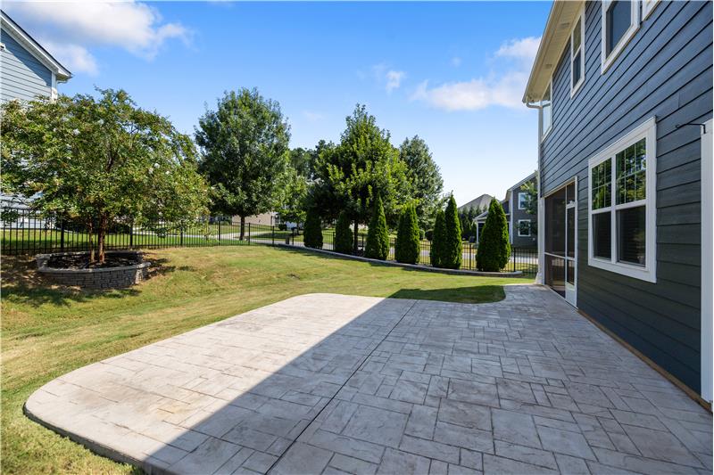 Expansive paver patio ideal for al-fresco dining, entertaining guests, grilling, or simply relaxing outdoors