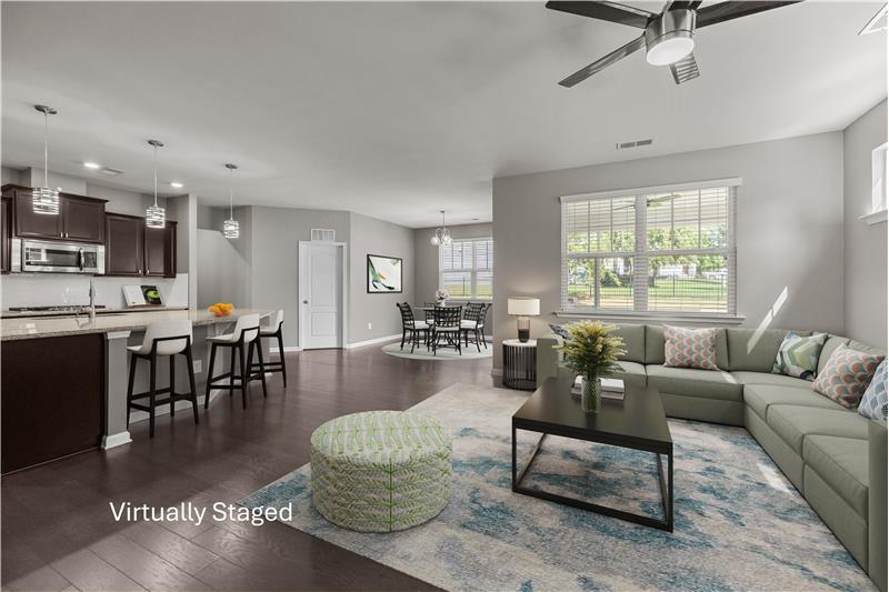 Open-concept living area perfect for gatherings, offering a blend of comfort, light, and modern charm