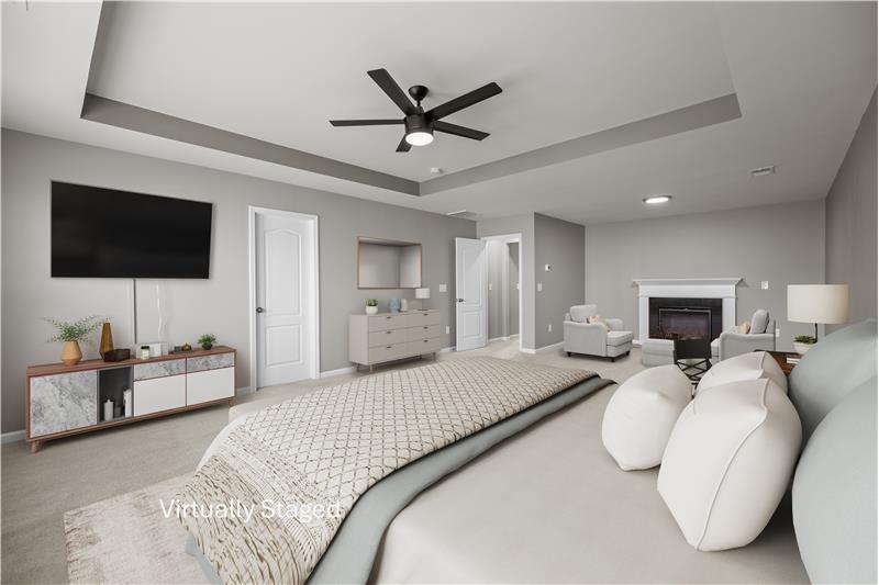 A true retreat, primary suite easily accommodates a king-size bed and features a spacious sitting area with fireplace