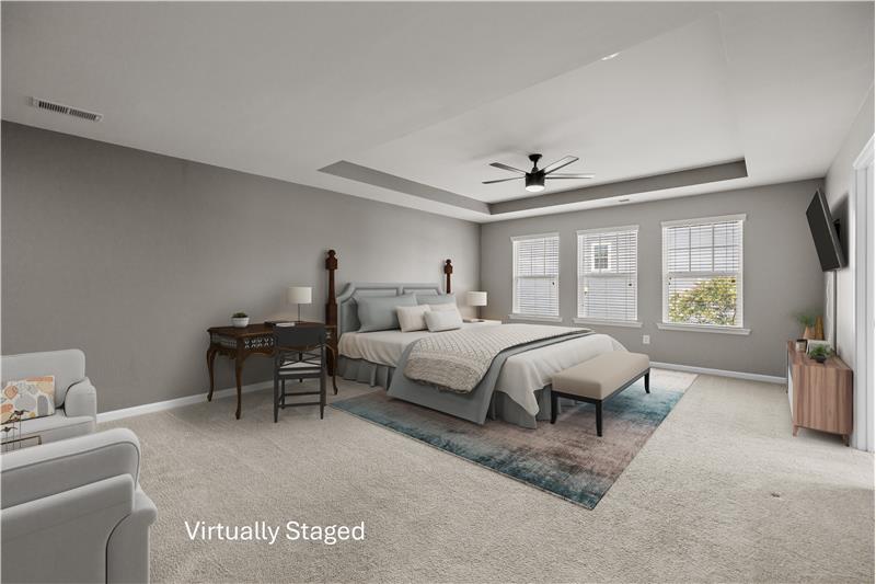 Exceptionally large primary bedroom offering comfort, versatility, and style