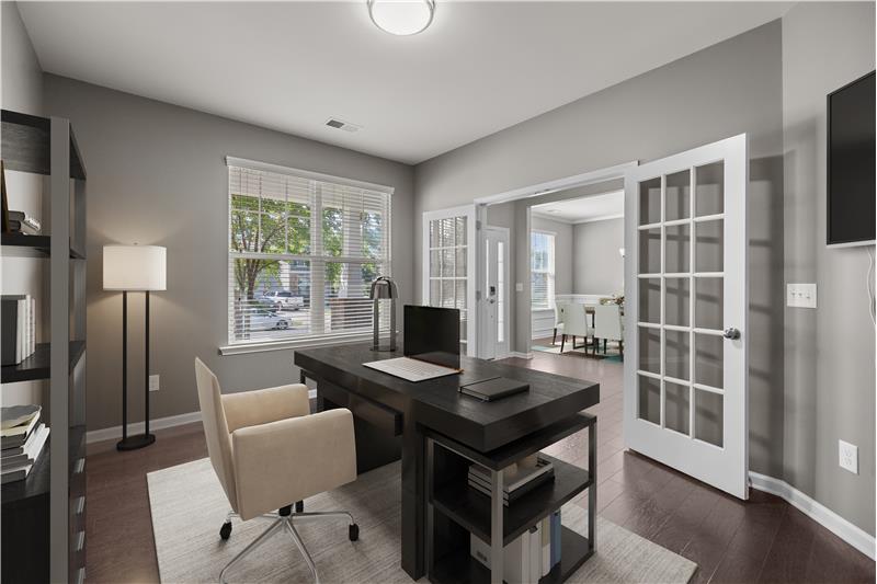 Perfect work-from-home retreat offering hardwood flooring, classic French door entry, and a serene atmosphere