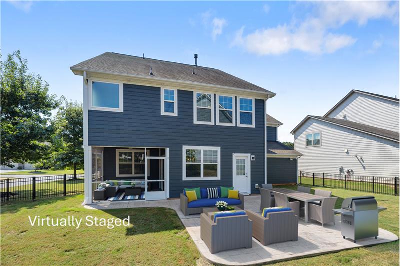 Oversized stamped concrete patio with room to entertain, relax, grill