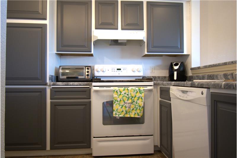 Newer cabinets and all appliances convey with home.