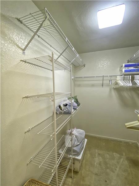 wire shelving in master closet