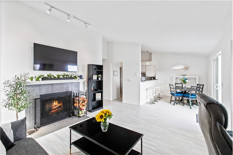 In the living room is a wood burning fire place for the cooler nights. Next to the dining room is the updated kitchen.