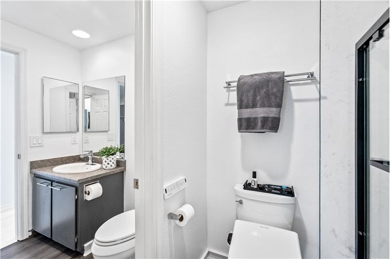 Leading to the half guest bath. Notice the new flooring in the bath?