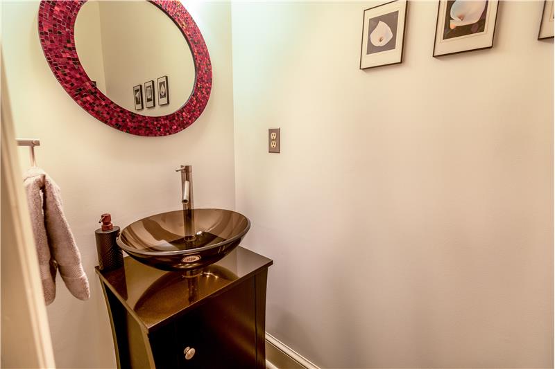 Powder room located off of foyer