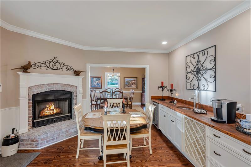 Wet bar and breakfast area with fireplace