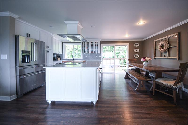 Gorgeous kitchen and dining room. Five-door KitchenAid refrigerator.