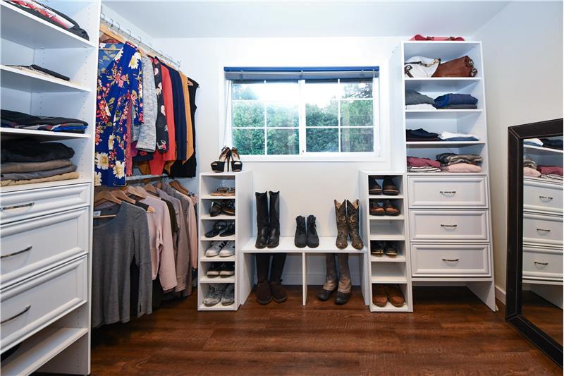 Master bedroom closet, plenty of room for shoes, boots, hanging clothes, and folded clothes.
