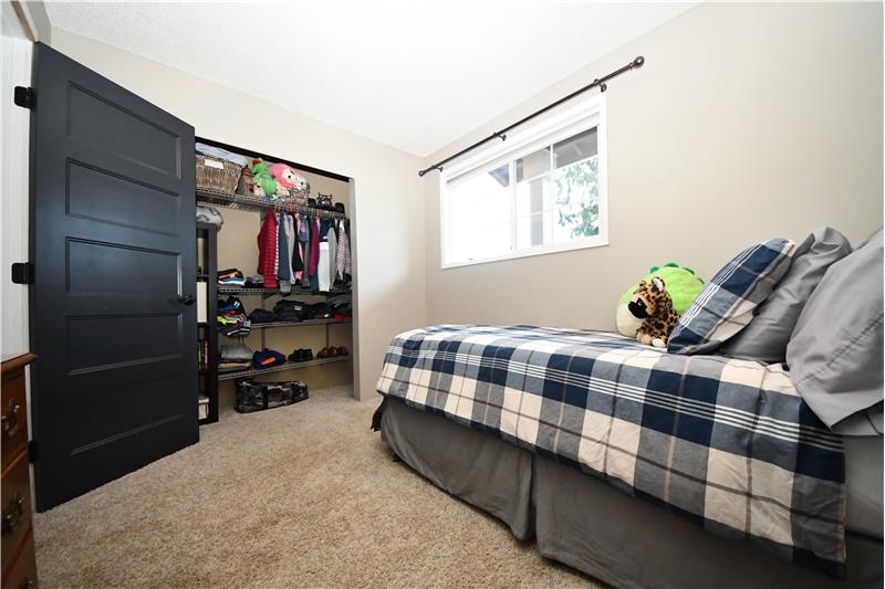 Fourth bedroom with California style closet system.