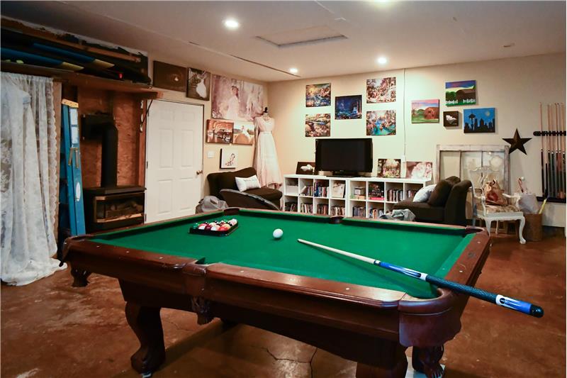 Garage converted into a game room and has been a professional photography studio in the recent past.