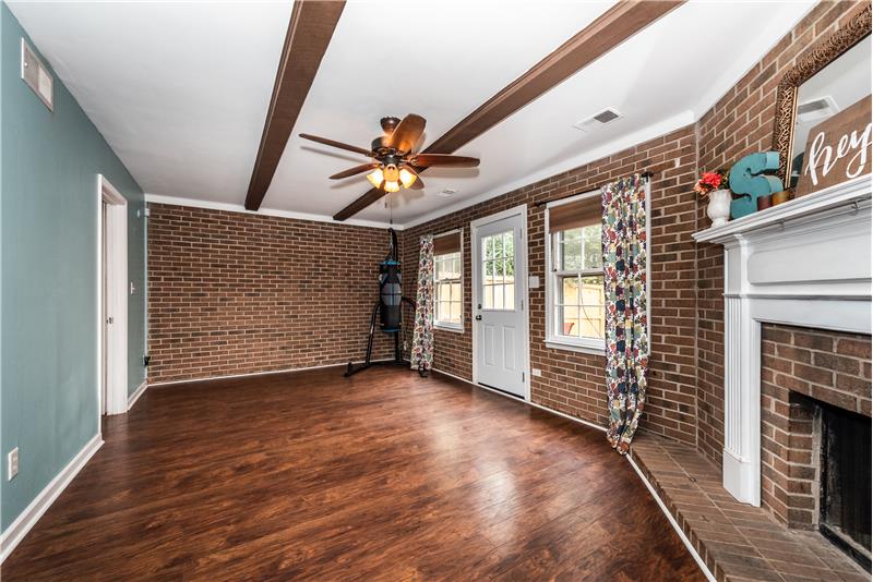 Walkout, finished basement, ceiling beams, ceiling fan with light.