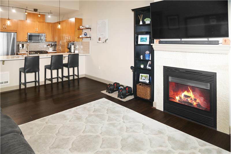 Open Concept with a Cozy, Tile Surround Gas Fireplace