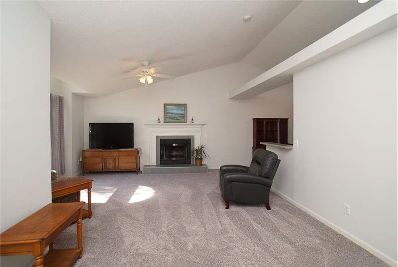Great room with neutral carpet