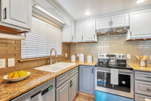 Beautiful Stone Countertops & Glass Tile Backsplash!