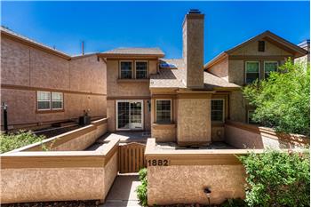 Enclosed courtyard with a concrete and paver patio for outdoor relaxation and fun.