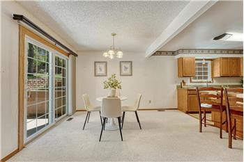 The dining area provides indoor-outdoor living with opening to the front courtyard, perfect for entertaining and outdoor dining.