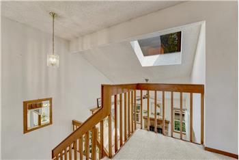 Skylight at the top of the stairs that floods the home with lots of natural sunlight.
