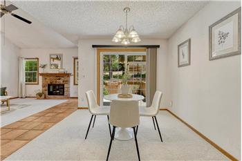 The dining area is located off the living room and kitchen for easy entertaining.