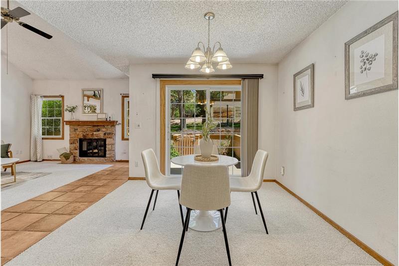 The dining area is located off the living room and kitchen for easy entertaining.