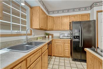 Inviting kitchen with two pantries, beautiful wood cabinetry and lots of counterspace for easy food preparation.
