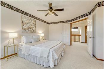 Upper level primary bedroom.