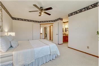 The primary bedroom has an adjoining shower bathroom.