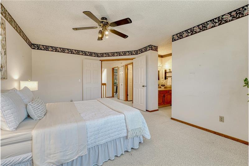 The primary bedroom has an adjoining shower bathroom.