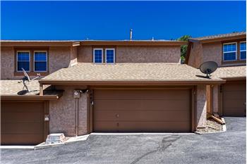 Over-sized 2-car garage with storage and a work area.