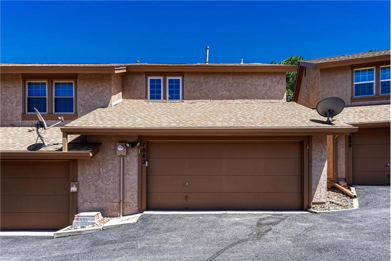 Over-sized 2-car garage with storage and a work area.