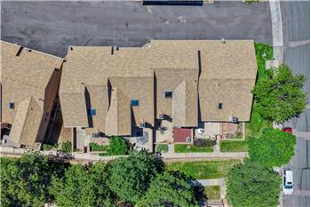 Arial view of complex and tree-line walkway.