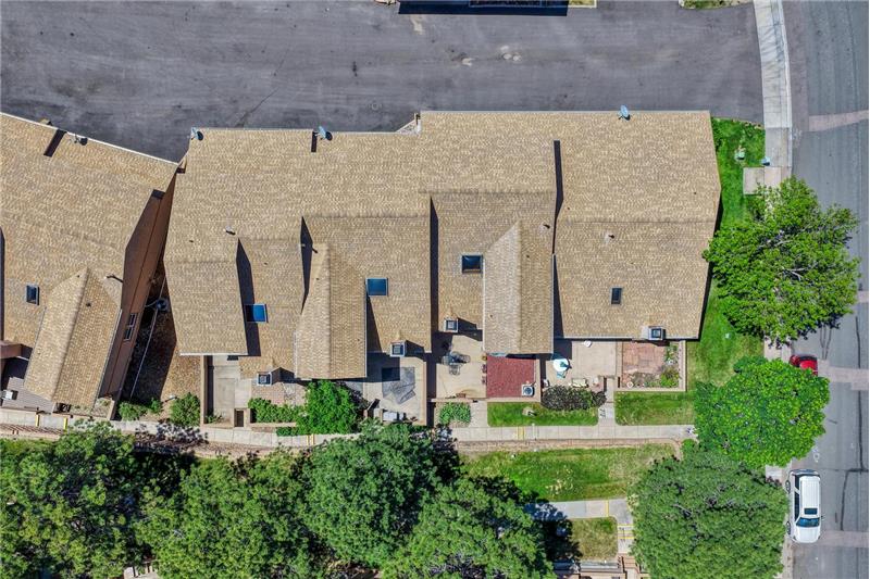 Arial view of complex and tree-line walkway.