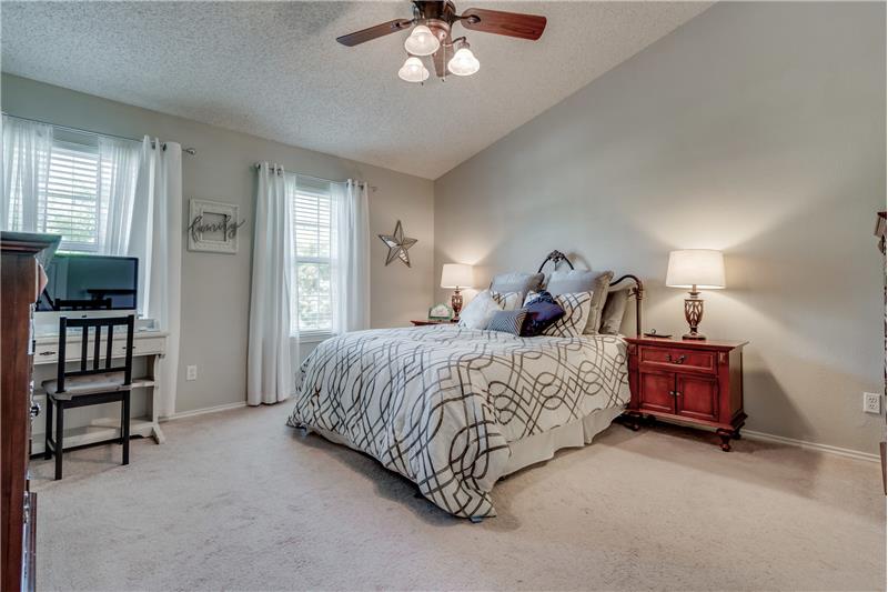 Tranquil master suite has room for a desk or sitting area