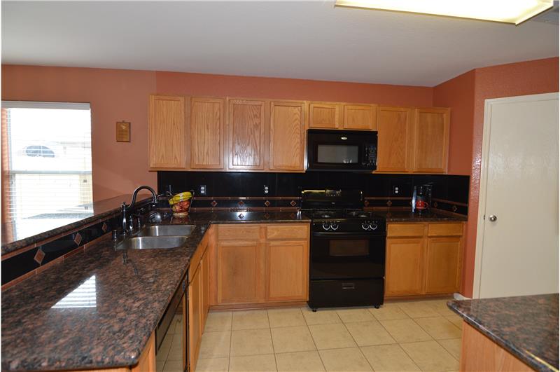 The kitchen has granite counter tops.