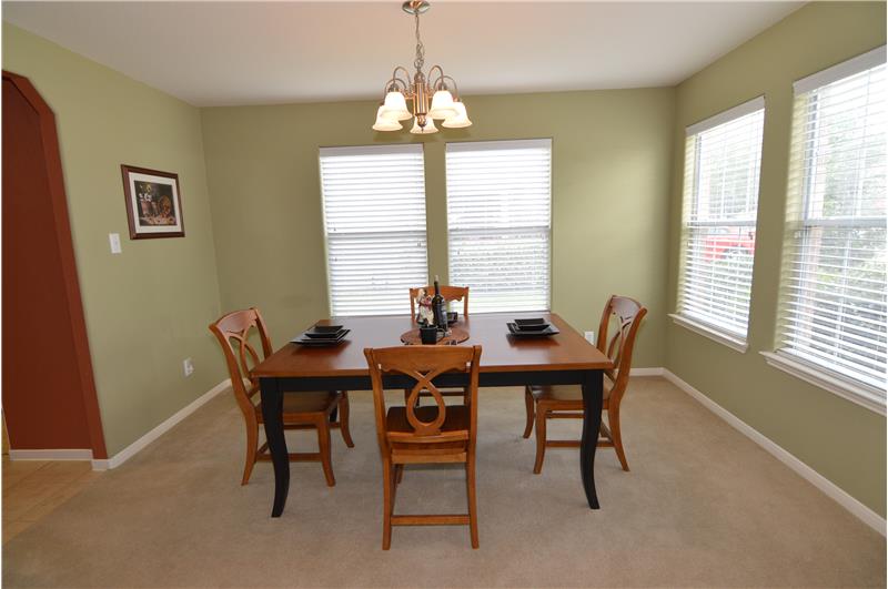 Another view of the dining room with natural lighting.