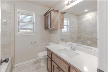 Secondary Bathroom with tub and shower