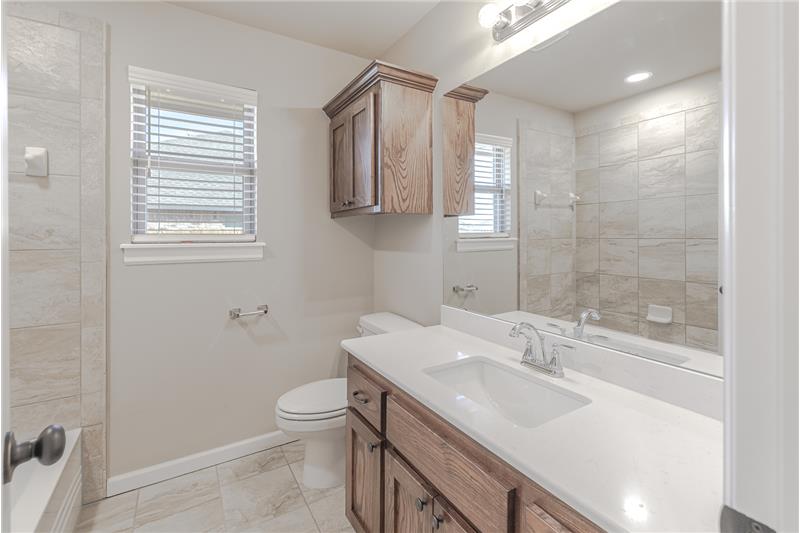 Secondary Bathroom with tub and shower