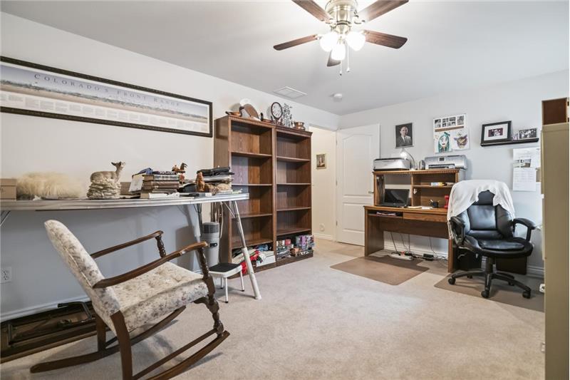 Third bedroom is oversized and features large closets and a ceiling fan.