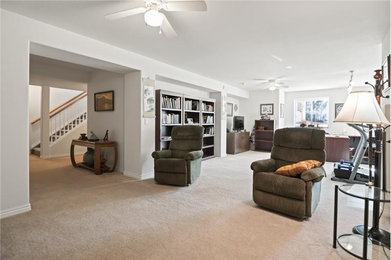 Family room has areas for entertainment center and study.
