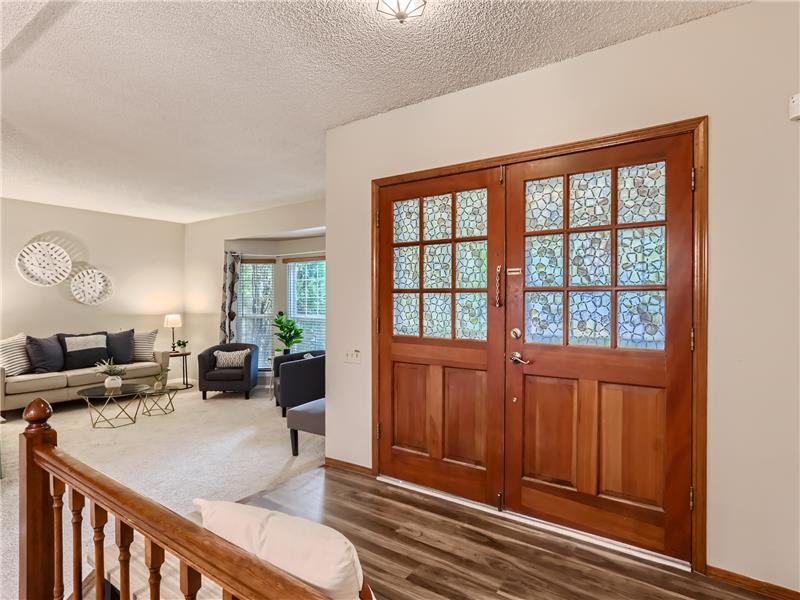 Double doors welcome you inside this spacious two story home with room and space for everyone.