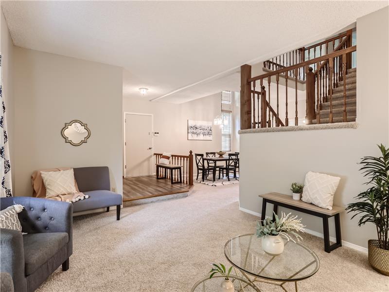 View from the living room, gives you a feel for the open entry, bright dining room and stairs that lead to the second level.
