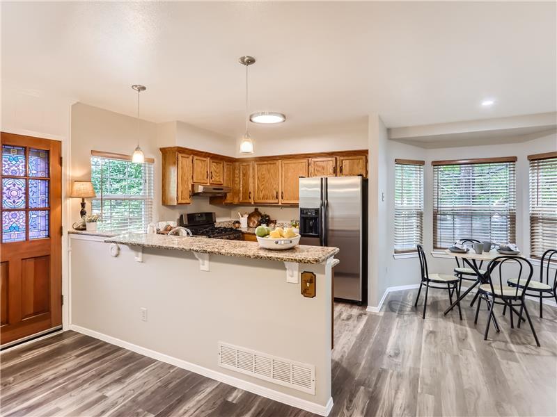This home has a breakfast bar, kitchen table area AND a dinning room; many options and always room for everyone!