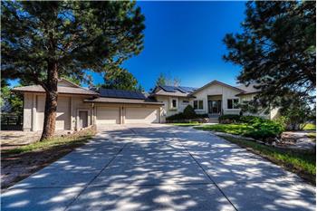 Stucco exterior with concrete tile roof, paid off solar, and 2.5 acres.