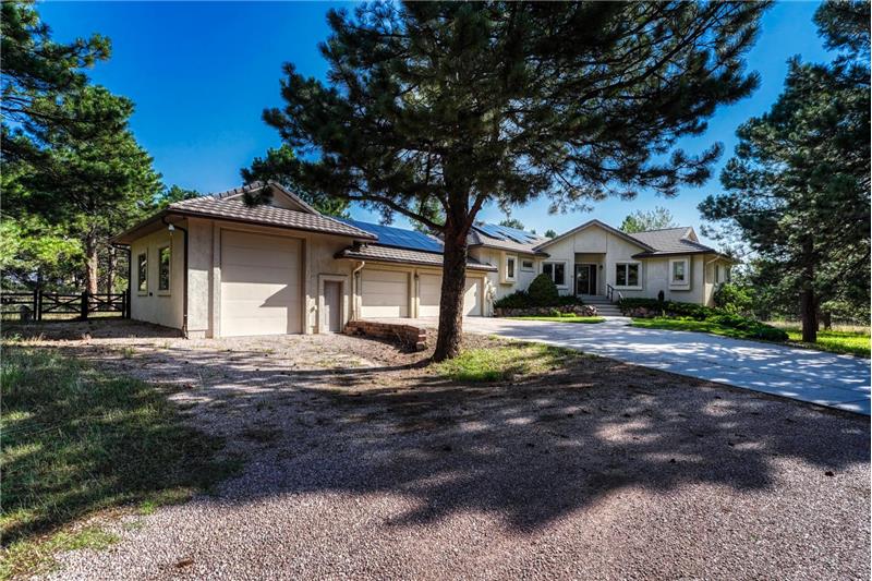 A heated 3-car garage  w/service door and utility sink plus a separate 20x30 RV garage.